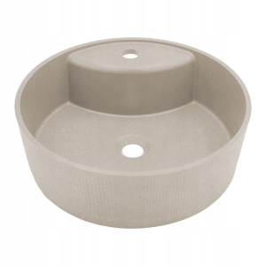 Runde Granit-Aufsatzspüle auf einer Arbeitsplatte aus mattem Granit in Beige